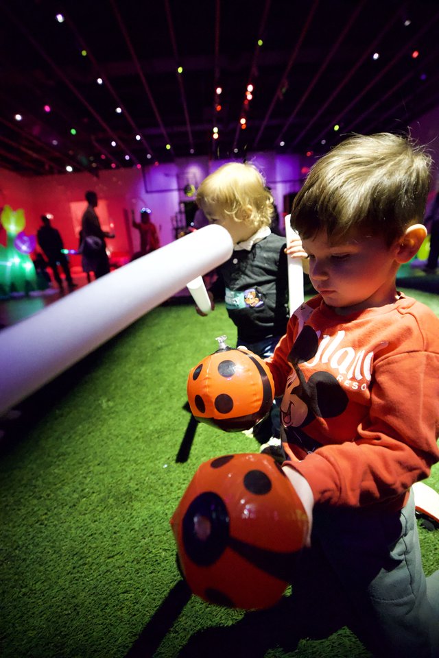 Children Engaging with Ladybug Robot at Baby Rave Event