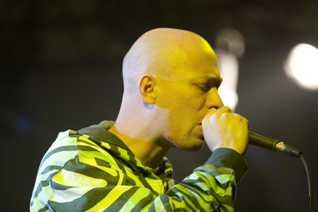 Bald Entertainer Rocks Coachella with Microphone in Mouth