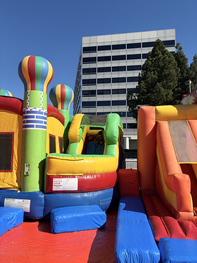 Colorful Inflatable Bounce House at Urban Outdoor Event
