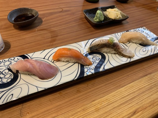 Sushi Sampler on a Wooden Plate