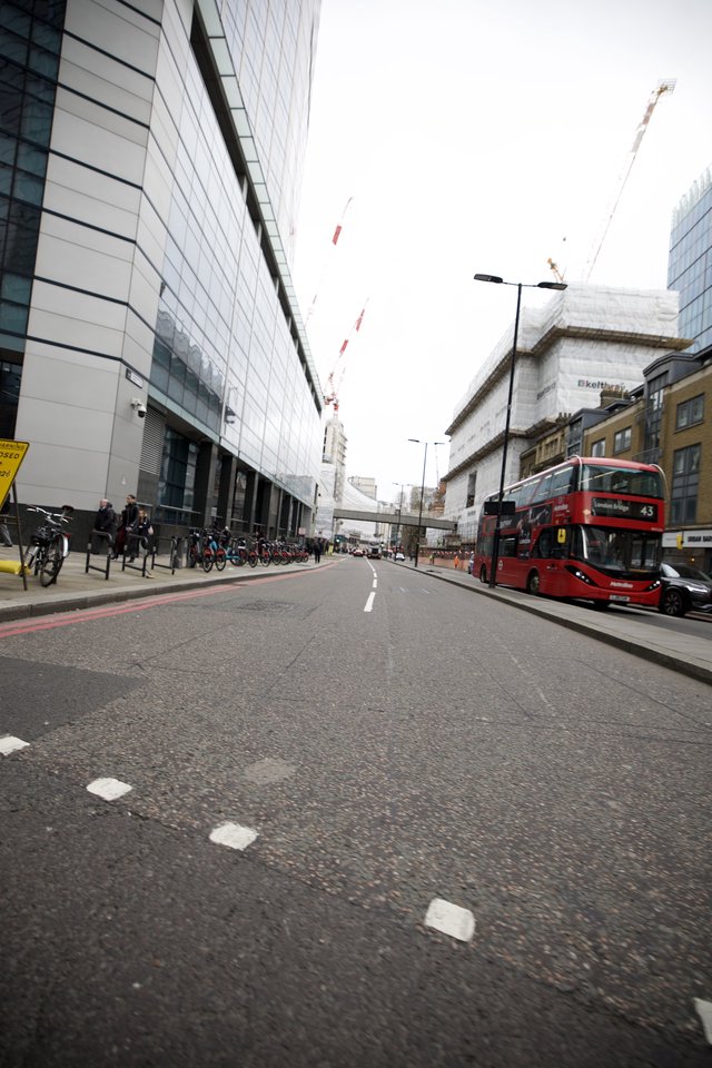 Red Double-Decker Bus on Modern London Street