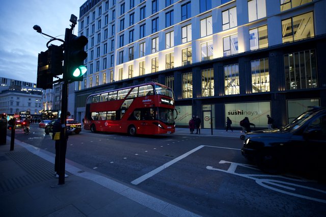 London Double-Decker Bus at Twilight Intersection