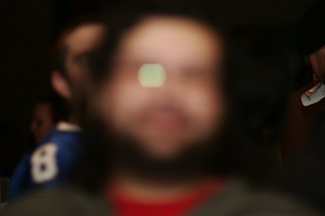Blurry Man With Beard and Glasses