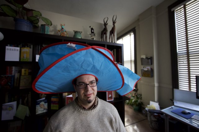 Hat-wearing Man Enjoys Indoors