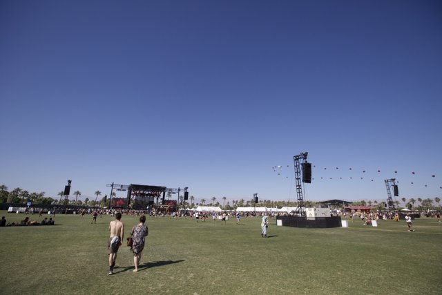 Festival-goers enjoy the grassy fields at Coachella