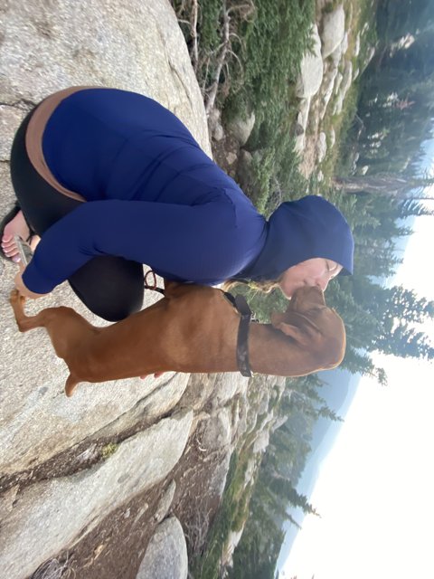 Woman and Dog on Rock in Desolation Wilderness