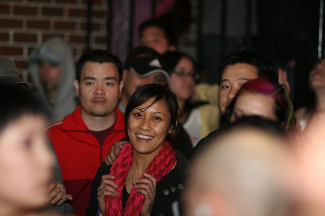 Woman's Joyful Moment in a Crowded Urban Club