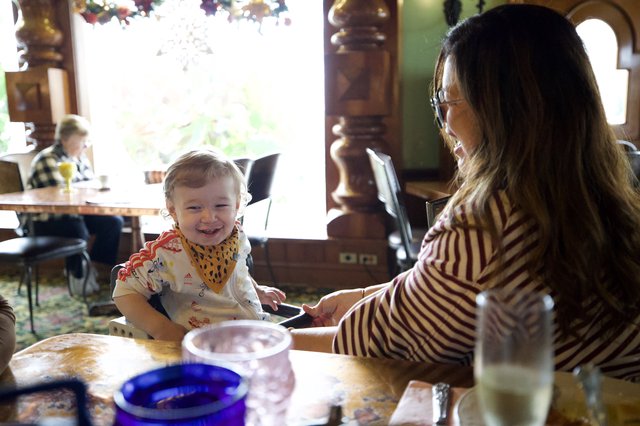 Mother and Toddler Sharing a Joyful Meal Together