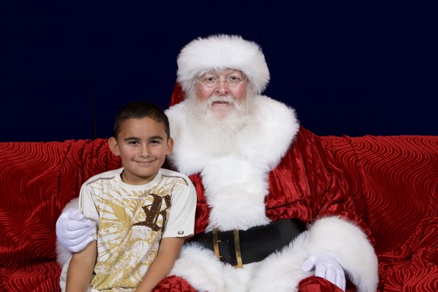 A boy and Santa on their favorite couch