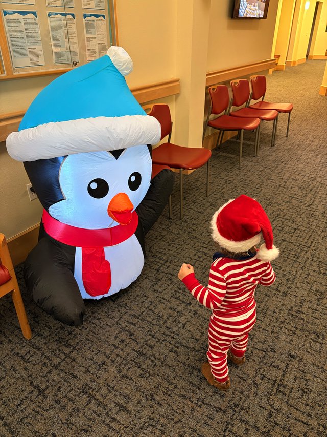 Toddler Meets Inflatable Snowman in Waiting Room