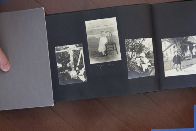 Bobby Hutchins Holds the 2012 Bullock Curtis Family Photo Album