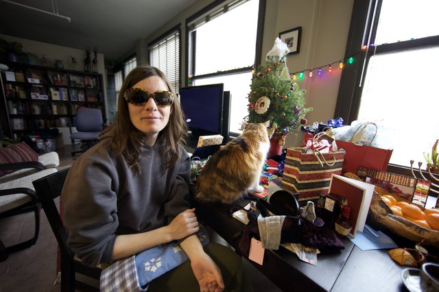 Penelope and Cat Amid Christmas Gifts and Cheer