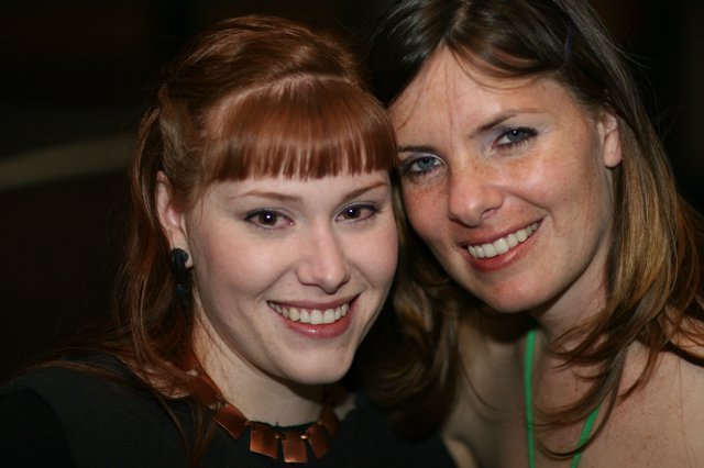 Two Smiling Women Share a Joyful Moment Together