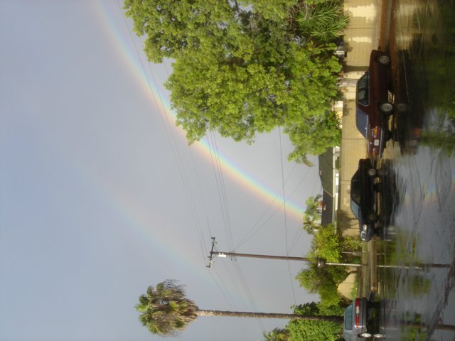 Double Rainbow Over Wet Pavement