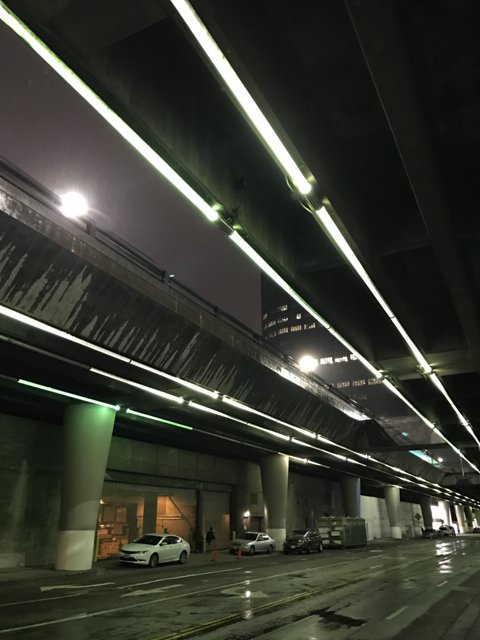 Parked Car Under Los Angeles Overpass at Night