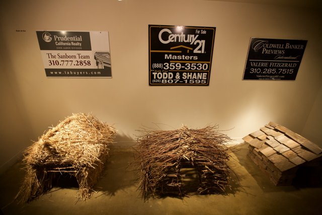 Three Straw Huts Advertise Nature-Friendly Businesses