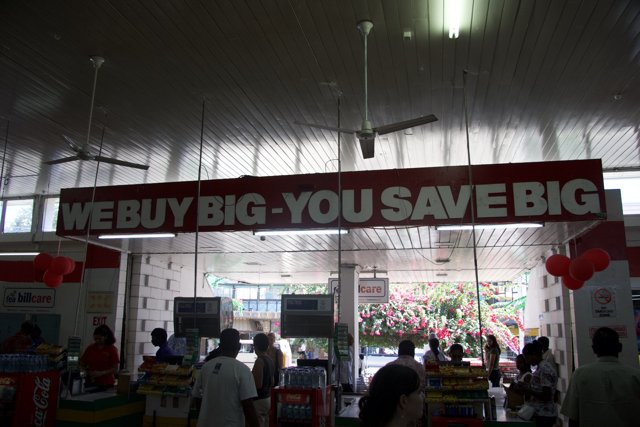 We Buy Big You Save Big Sign