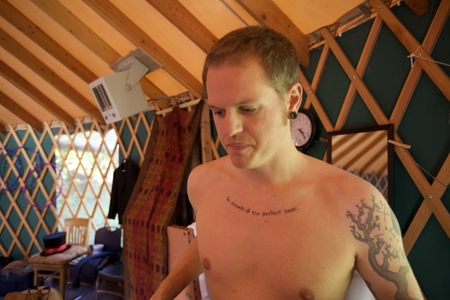 Tattooed Man in a Yurt