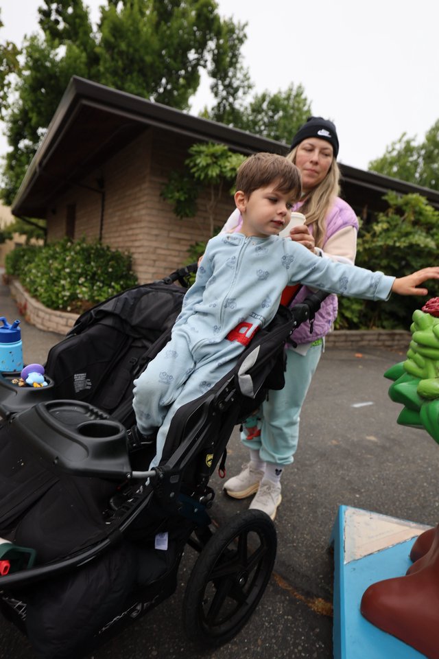 Young Boy Reaches Out at Balloon Festival