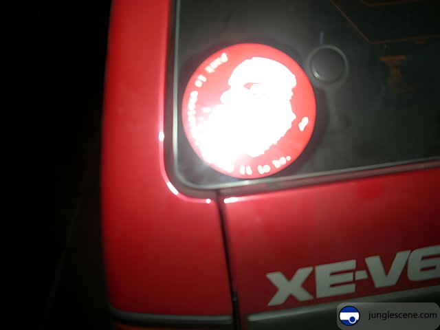 A Train-themed Sticker on a Red Car
