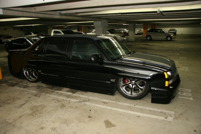 Alloy Wheels on a Black Truck in a Parking Garage