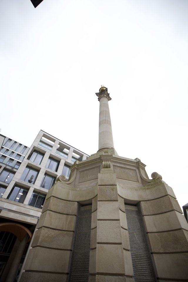 Classical Stone Column Monument in Urban London Setting