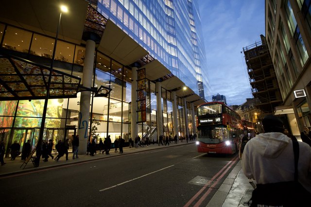 Modern London Architecture at Twilight with Red Bus