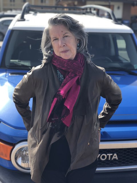 Lady with a Blue Toyota Truck