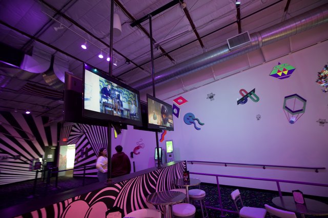 Contemporary Digital Art Gallery with Purple Neon Ambiance