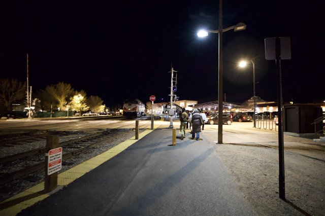 Night Arrival at Illuminated Train Station Platform