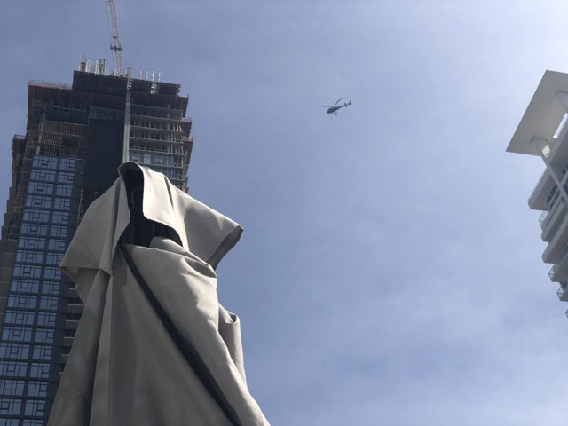 High-Flying Helicopter above the Cityscape