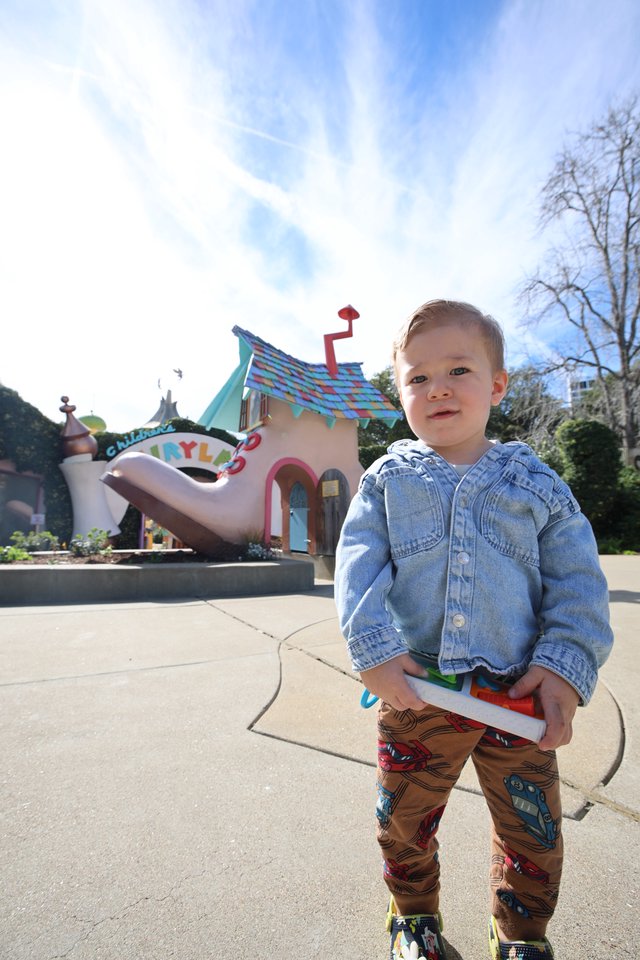 Toddler at Toontown Amusement Park on Sunny Day
