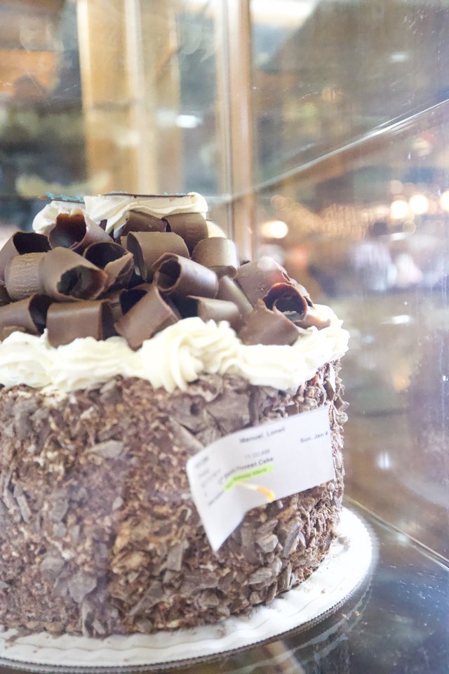 Decadent Chocolate Cake Display in Bakery Window