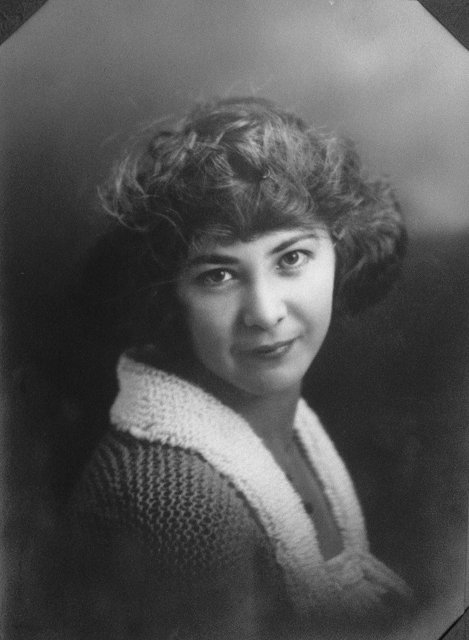 Vintage Portrait of a Happy Woman with Curly Hair
