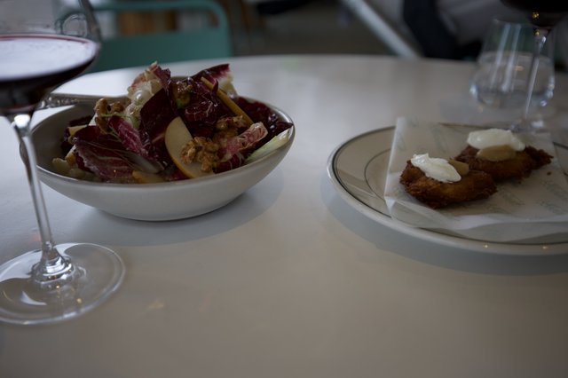Elegant Restaurant Dining with Radicchio Salad and Breaded Cutlet