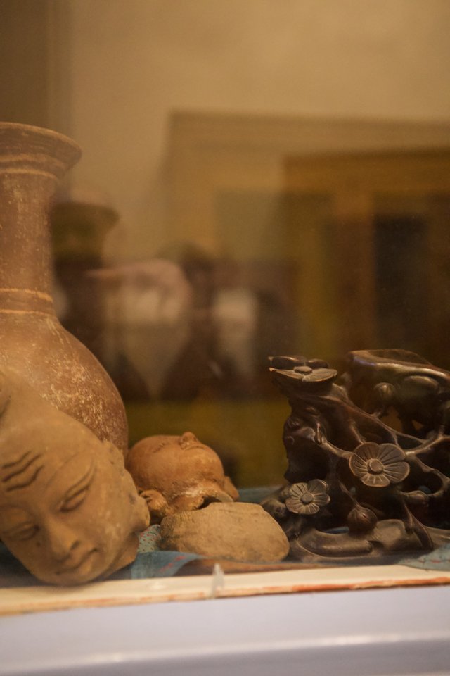 Tranquil Still Life with Buddha and Asian Ceramics