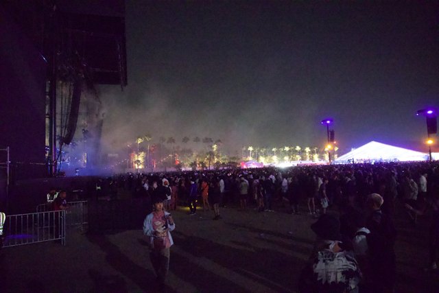 A Vibrant Night at Coachella 2024: Crowds and Colors Under the Desert Sky
