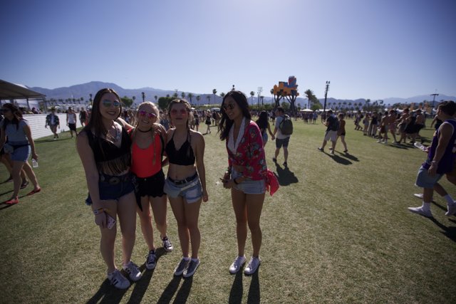 Three Girls at Coachella Caption: Madeline Weinstein and her friends take a break from the music and festivities to capture a moment in front of the beautiful blue sky and rolling hills at Coachella.