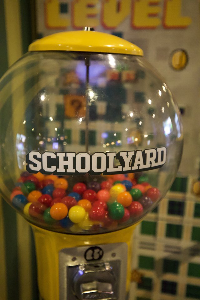 Vintage Yellow Schoolyard Gumball Machine with Colorful Candies