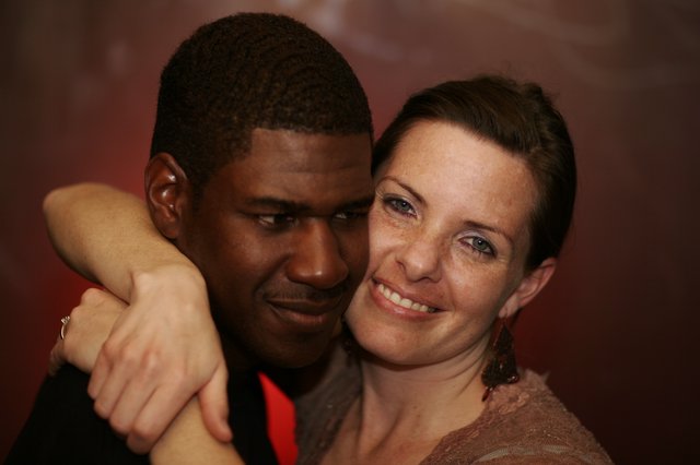 Intimate Embrace Between Two People at Evening Event