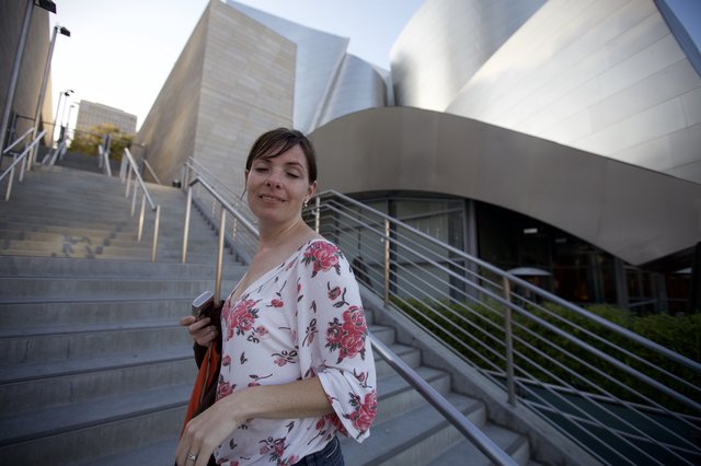 Woman Pauses at Walt Disney Concert Hall Steps