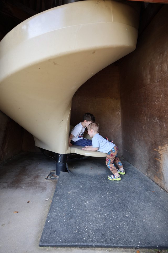 Children Exploring Tunnel Slide at Fantasyland Playground