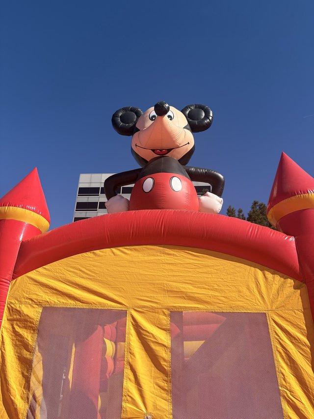 Cheerful Monkey Inflatable Bounce House at Outdoor Event