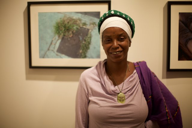 Smiling Woman in Turban Surrounded by Art