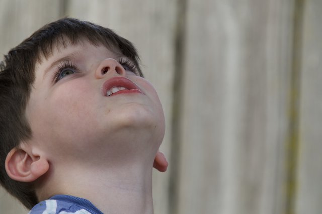 Child Looking Up in Wonder and Curiosity