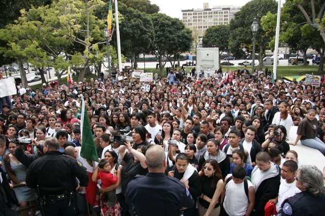 Man Addressing Large Crowd at School Walkout