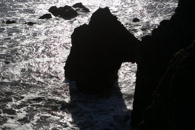 Sunlit Rock Formation in the Ocean