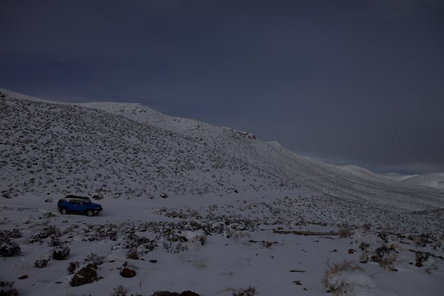 Blue Truck Braving the Winter Slope
