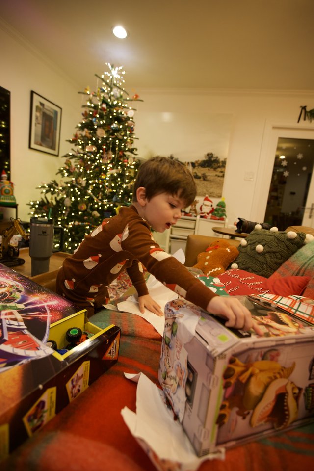 Christmas Morning Joy: Child Opening Presents