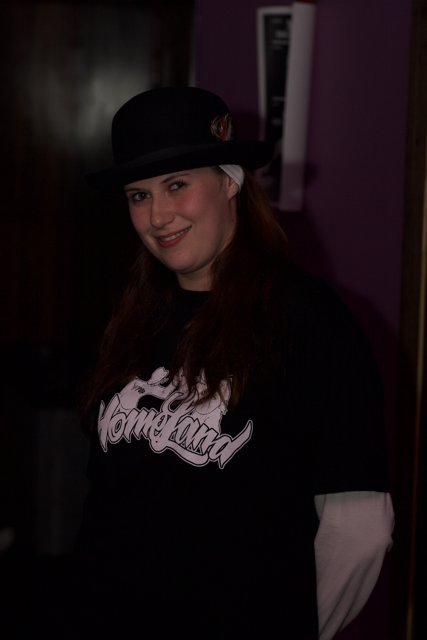 Stylish Woman in Black Shirt and Hat